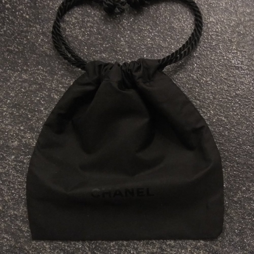 Chanel Black Pouch 4" x 4" with satin braided draw cord. Mini Wrist Pocketbook